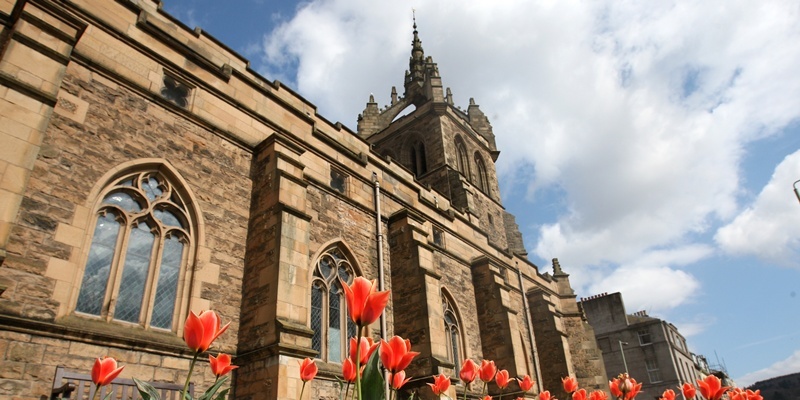 St Leonards-in-the-Fields Church, Perth.    Scenic picture showing tulips and the church in the sunlight.