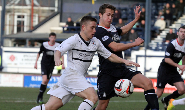 John Baird, left, on the attack for Raith Rovers.