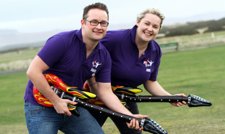 Montrose Music Festival chairman David Paton and Anne Jenkins get in the spirit ahead of the Status Quo gig at East Links.