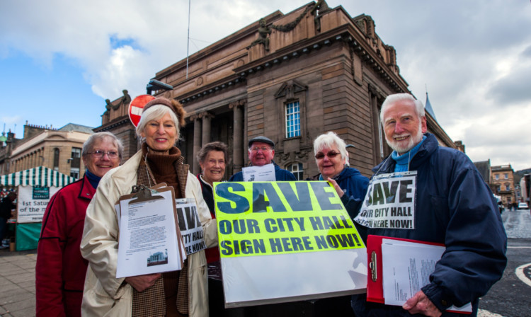 The Save Perth City Hall petition. Event organiser Margaretha Linacre, with clipboard, alongside other supporters who turned out to gather signatures to help save the city hall.