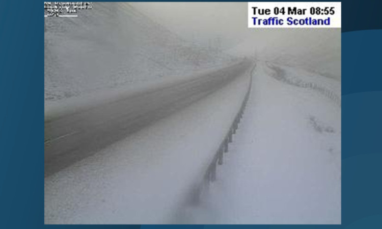 A live traffic camera image showing snow at Drumochter just before 9am.