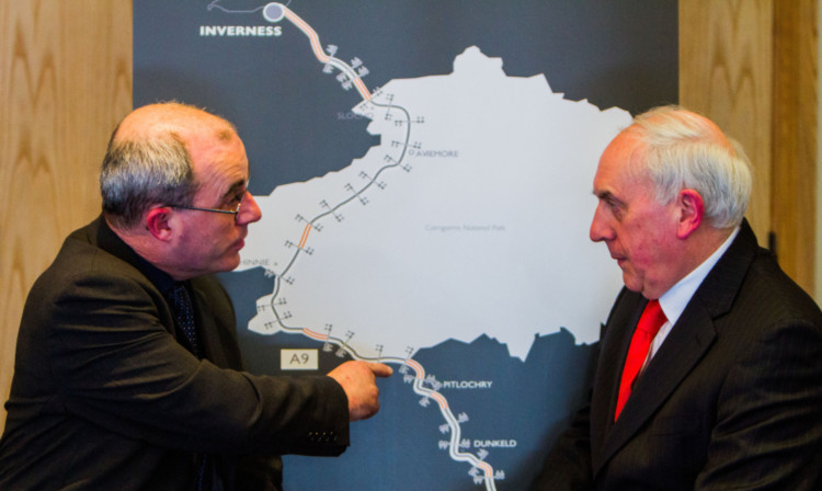 Stuart Wilson, strategic road safety manager at Transport Scotland, left, discussing the A9 with John Leitch, distribution director of CJ Lang.