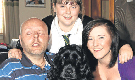 Keith with his daughters Jordan and Nikki and pet spaniel.
