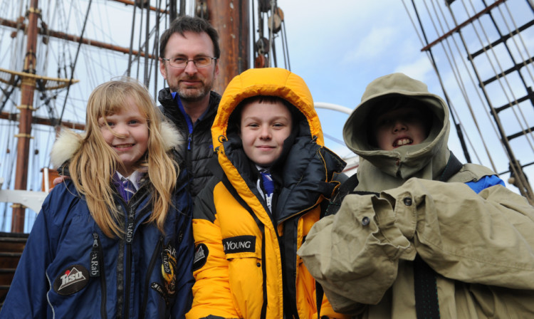 On the RRS Discovery are Ballumbie Primary School pupils, from left, Ami Hughes, Jonay Crosby and Lewis Small with Craig Mathieson.