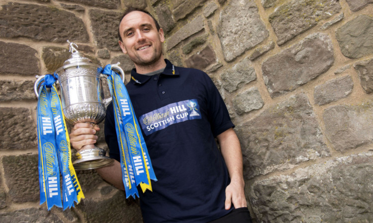 St Johnstones Lee Croft with the trophy he expects Saints to be playing for in Mays cup final.