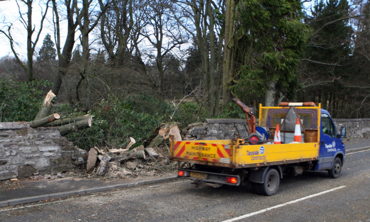 High winds brought down a tree across the A93 causing the road to be closed while the tree was cleared.