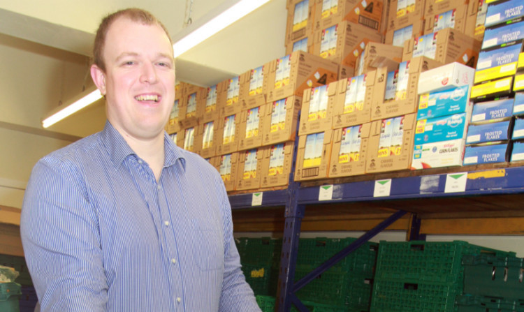 Dave Morris stays upbeat during busy times for the foodbank.