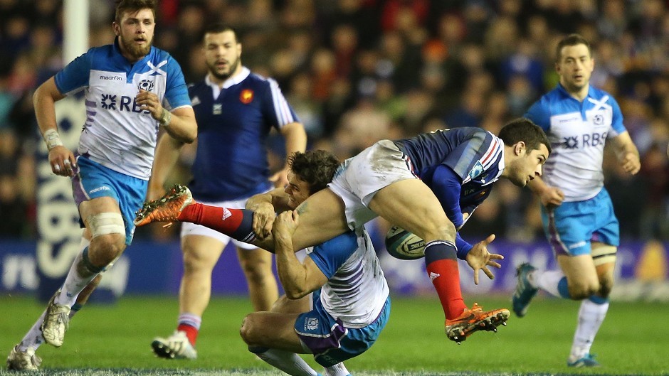 Scotland's Max Evans tackles France's Brice Dulin at Murrayfield