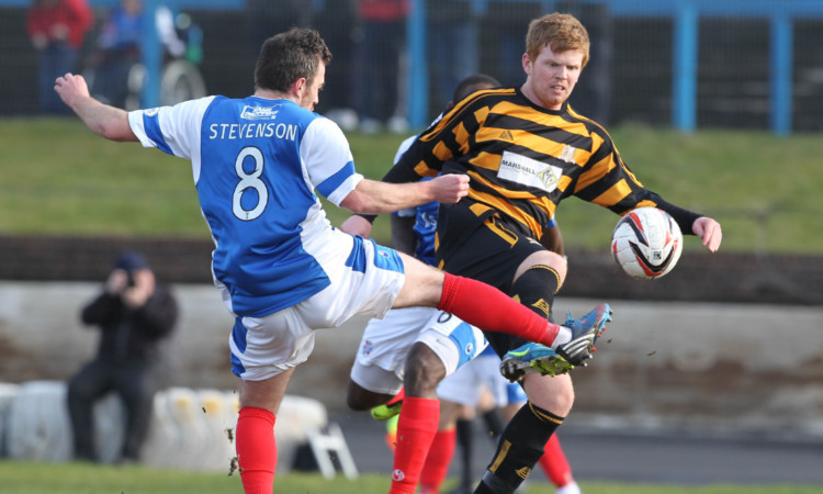 Alloas Ryan McCord tangles with Jamie Stevenson as the sides battle to a 2-2 draw.