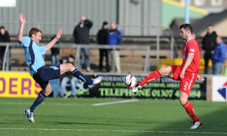 Forfars Gary Fusco and Steve Jackson of Brechin go for the ball at Station Park.