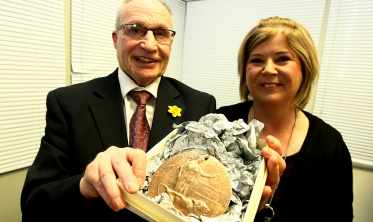 David Greener and Linda McDonald with Septimus Greeners memorial plaque.