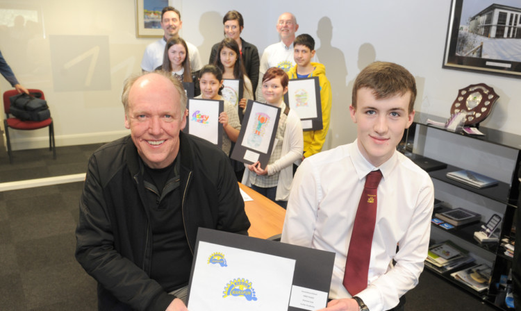 Front; Jaguar desinger Ian Callum with overall winner Duncan Low. Back (from left) - Rotarians  Scott Ballantyne, Paula Elvin and Gordon Peterkin. Middle - Prizewinners Gemma Fraser, Nadia Assakali, Sureshta Singh, McKenzie Sutherland and Hugo Morrow.