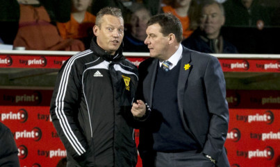 Tommy Wright speaks to fourth official Iain Brines.