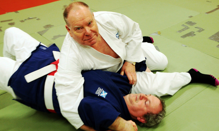 Lord Provost and SSJA patron Bob Duncan gets to grips with the art of Ju Jitsu as he grapples Patxi Escribana Lasa, 4th Dan Ju Jitsu and SJJA national coach.