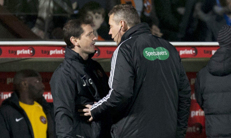 Jackie McNamara is spoken to by fourth official Iain Brines during the bust-up at Tannadice.