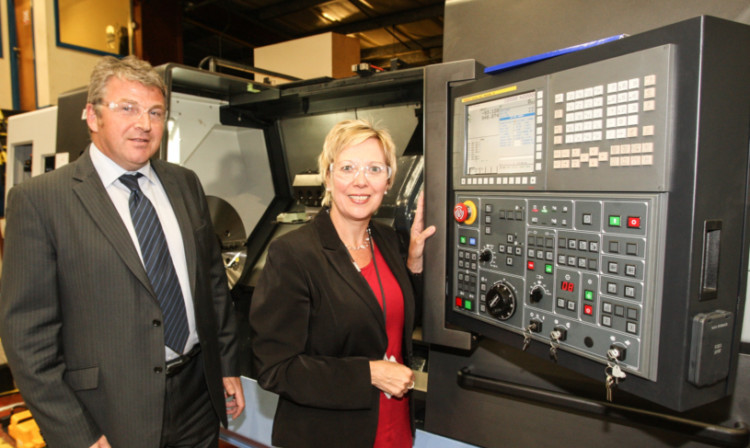 Duncan McDougall shows Councillor Lesley Laird one of Proclads latest acquisitions, a CNC lathe. Profits at the firm have been boosted by new investment.