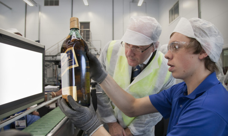 Spirits bottled by drinks giant Diageo at its site in Leven  seen here being visited by Finance Secretary John Swinney  took the top two spots by value and volume in Impact Databanks list of the top 100 spirit brands.