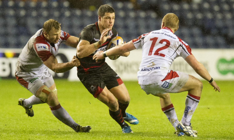 Edinburgh scrum-half Grayson Hart tries to make his way past Stephen Ferris, left, and Luke Marshall.