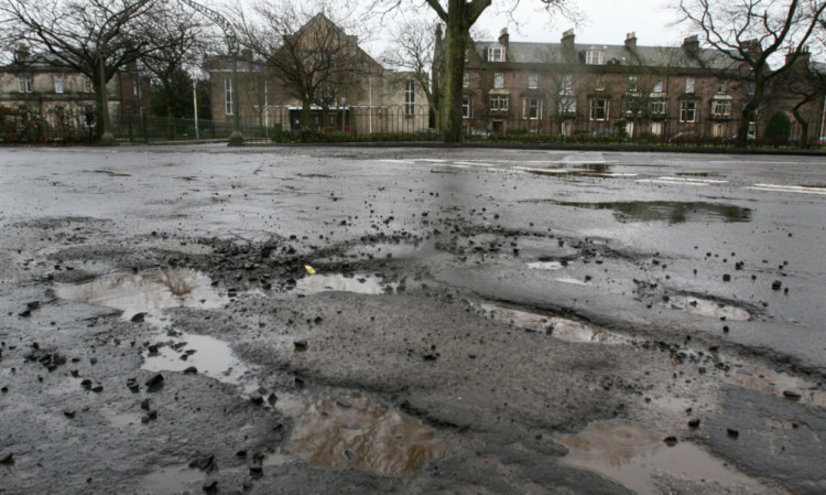 Potholes in the road at the junction of Panmure Place and Gibson Place in Montrose.