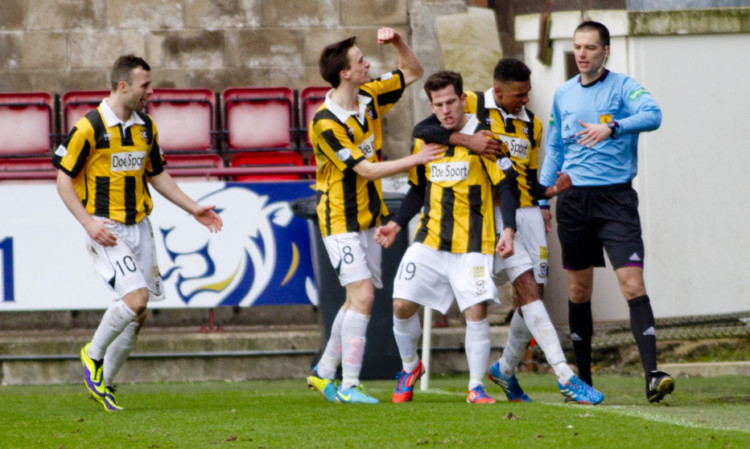 Liam Buchanan (centre) celebrates after netting East Fifes equaliser from the penalty spot.