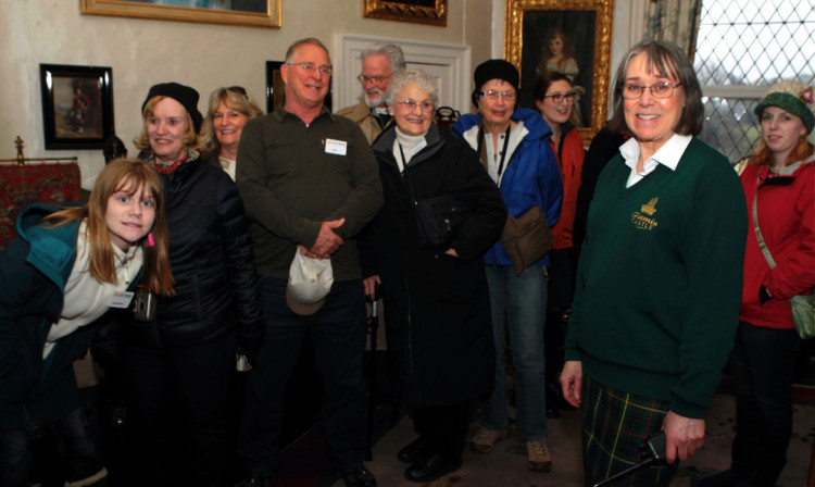 Guide Pauline Cawdery shows off the home to a group of tourists.