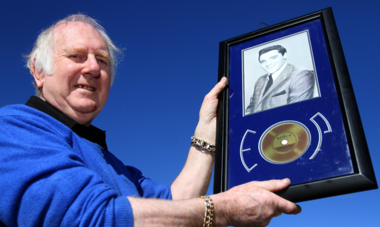 Robert Stark from Newburgh with the disc and lock of Elvis Presleys hair bought by his late wife Sheena.