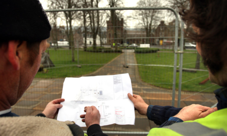 Geddes Group staff look at plans before starting work on the Watson-Watt statue plinth. The full-sized model will be similar to the marquette below.