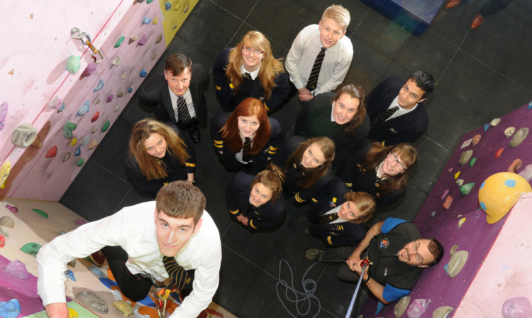 Steven Stewart leads the way on the climbing wall in Perth High School, watched by some of his fellow Gold Duke of Edinburgh Award recipients, depute head teacher Robin Illsley and Tony McClelland, outdoor education instructor.