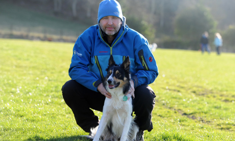 Ready for his first assessment: Earle Wilson with Tay, who has qualified as a mountain rescue dog.