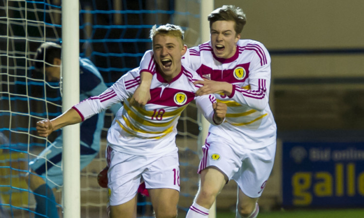Jake Sheppard (left) and Craig Wighton celebrate Sheppard's goal for Scotland.