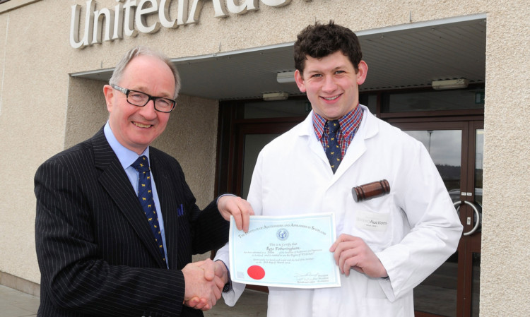 Ross Fotheringham receives his FIA (Scot) certificate from past president of the Institute of Auctioneers and Appraisers Scotland (IAAS) and executive chairman of United Auctions David Leggat.