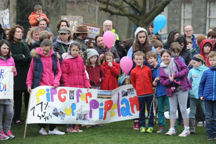 Around 250 protesters gathered in the centre of St Andrews on March 29 to Pipe up for Pipeland as the site for a new Madras College. Parents and their children turned up with banners and balloons to show their dismay at the decision of North East Fife councillors to vote against building a new Madras College at Pipeland. The event, which took place outside Madras College on South Street, saw speeches by parents and a march behind a piper.