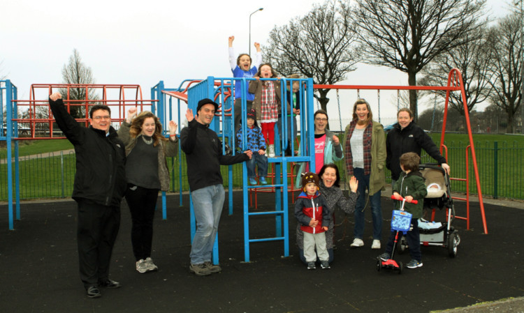 Members of the Friends Of Magdalen Green rasing a cheer with Cllr Richard McCready, as the playpark is to get an upgrade.