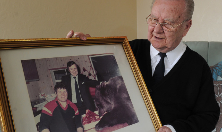 Joe Kennedy with a photograph of when he met Hercules the bear.