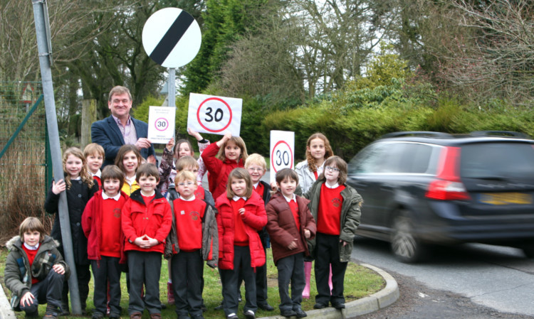 Councillor Bill Bowles with pupils from Monikie Primary School as they protest about speeding traffic in the village.