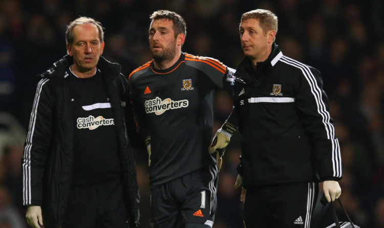 Allan McGregor is helped off the pitch by Hull City medical staff after his injury against West Ham.
