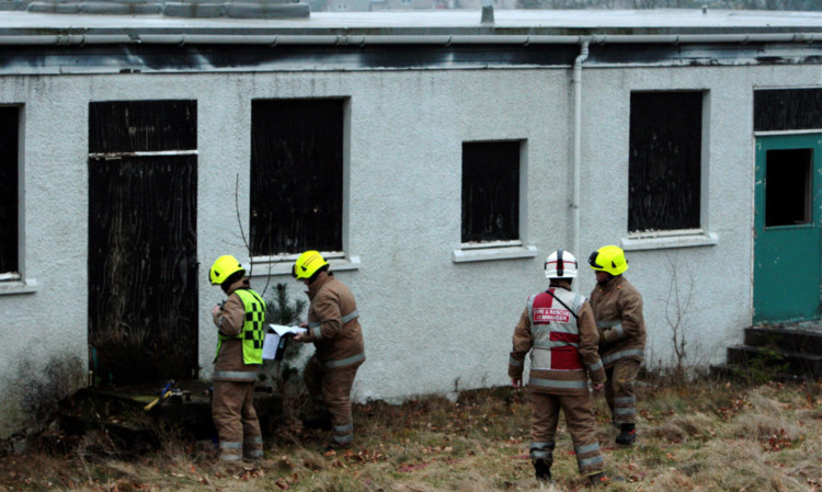 Members of the emergency services attending the fire in an outbuilding of the derelict hospital on Wednesday.