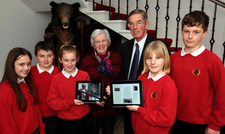 From left: Ciara McIntosh, Shaun Gordon, Alanah Rumcie, Mrs Christy Bing, Viscount Keith Arbuthnott, Cait McKay and Luke Woodley with the new digital guide.