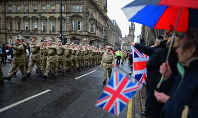 Around 200 soldiers from The Royal Scots Dragoon Guards take part in a homecoming parade in Glasgow.