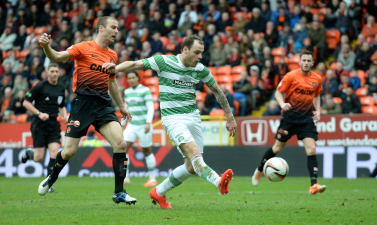 Celtic's Anthony Stokes gets in front of Sean Dillon to double the lead for the visitors.