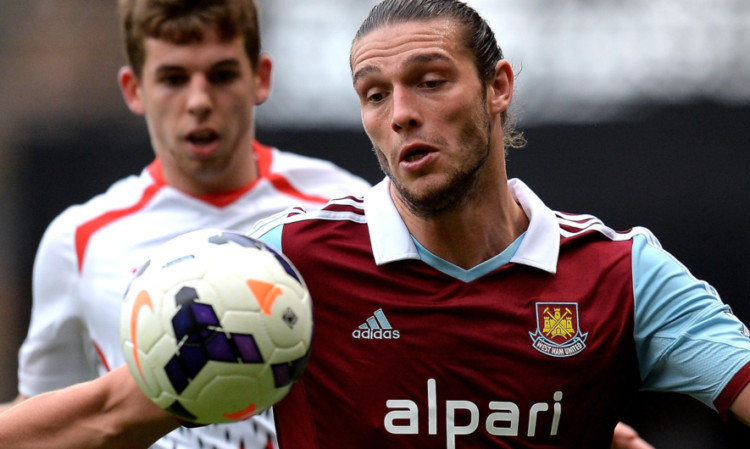 Andy Carroll in action against Liverpool.