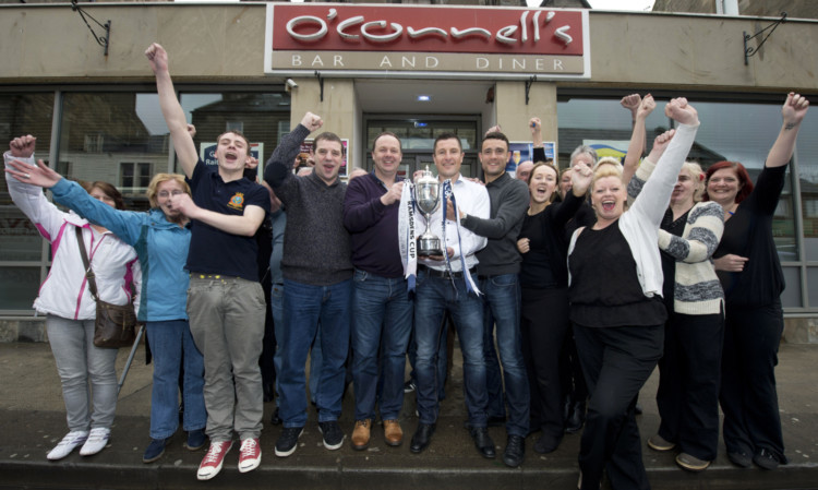 Raith Rovers manager Grant Murray, centre, joins coaches Paul Smith, centre left, Laurie Ellis, centre right, and fans as they celebrate their Ramsdens Cup win over Rangers.