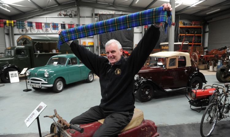 Club chairman Allan Burt with some of the vehicles on show.