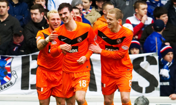 Gaving Gunning, centre, celebrates after scoring against Rangers at Ibrox in the Scottish Cup in 2012.