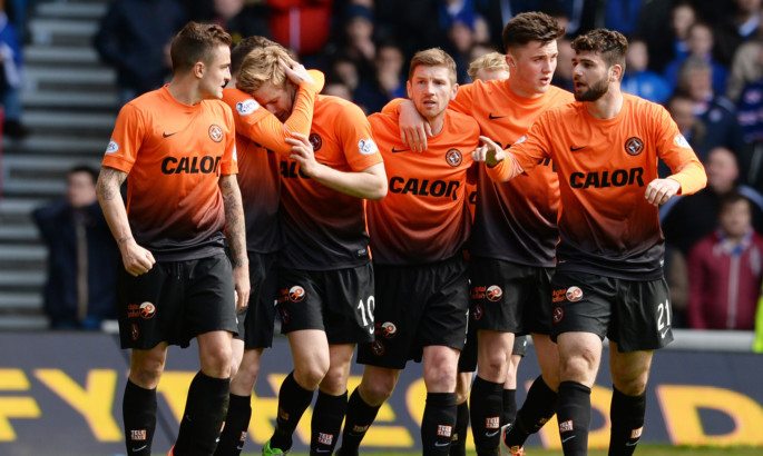 Stuart Armstrong celebrates with his teammates after opening the scoring.