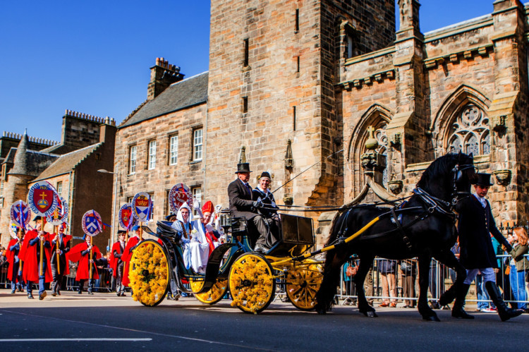 Hundreds of people lined the streets of St Andrews for the annual Kate Kennedy Parade. Students help bring the universitys 600-year history to life by dressing up as famous historical characters. 'Kate Kennedy' played by Adam Kent and Bishop played by Francis Walters.