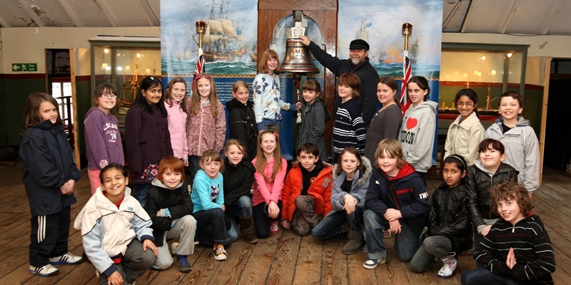 Steve MacDougall, Courier, Frigate Unicorn, Dundee. The 187th anniversary of the Frigate Unicorn and pupils from Clepington Primary will be going there to sing happy birthday. Pictured, children from Primary 5B and at the centre holding the bell is pupil Robyn Thomson alongside Bob Hovell (Ship Manager).