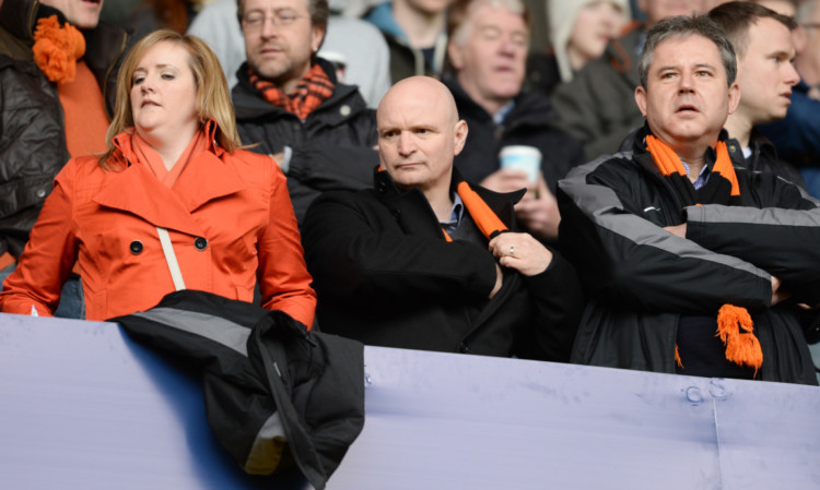 Stephen Thompson watchers the action with the fans at Ibrox.