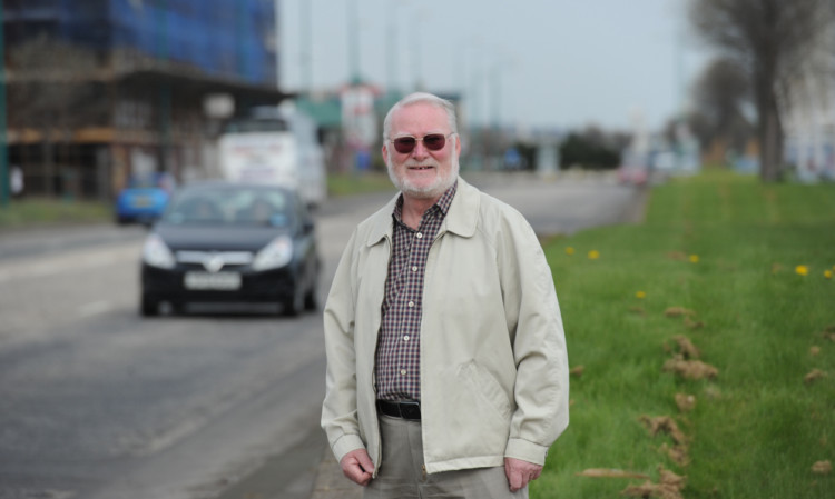 West End Community Council chairman Andrew McBride beside the section of Riverside Drive where there is a proposed lowering of the speed limit between the Tesco roundabout and the Tay Rail Bridge.