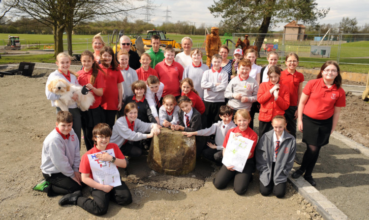 The campaigning pupils and staff of Townhill Primary School with the fossil.